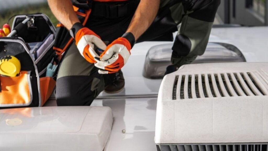 Frustrated RV owner fanning themselves inside overheated camper